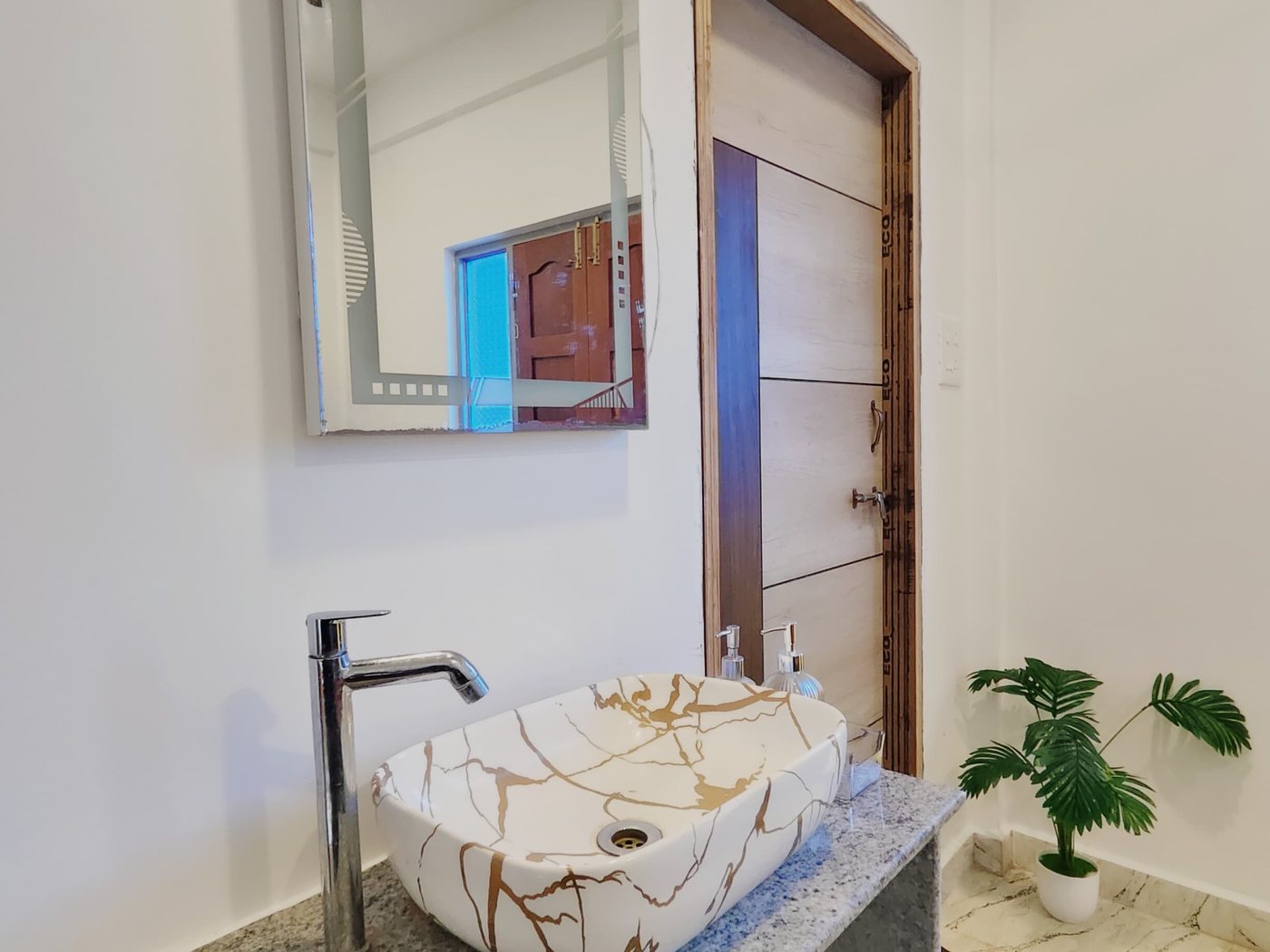 Attached bathrooms with stone basins and hot water.