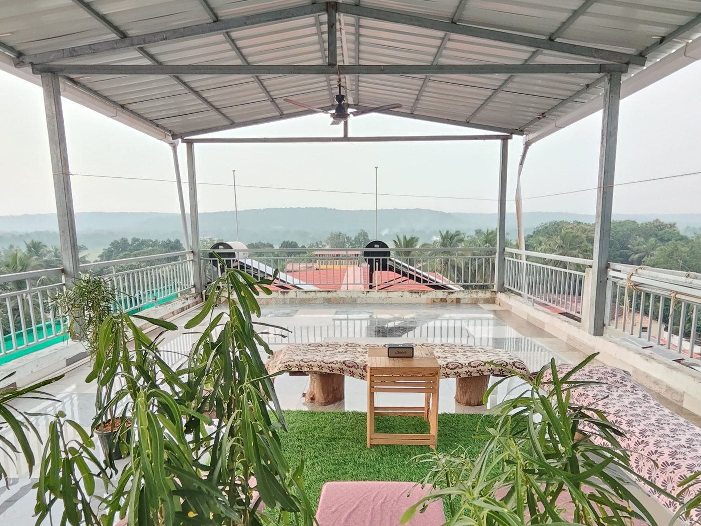 Under the terrace roof, looking out to the hills